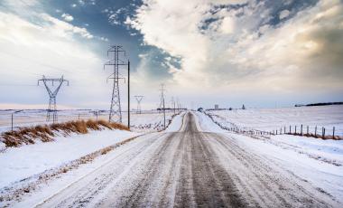 alberta rural road with transmission lines